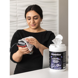 Picture of Spa Staff wiping down equipment with Prevention Wipes One-Step Disinfectant Cleaner (PRV-2C221)